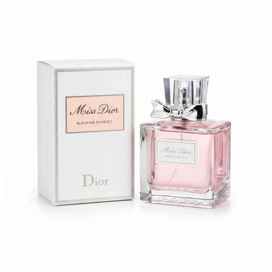 Miss Dior perfume bottle and packaging on a wooden surface